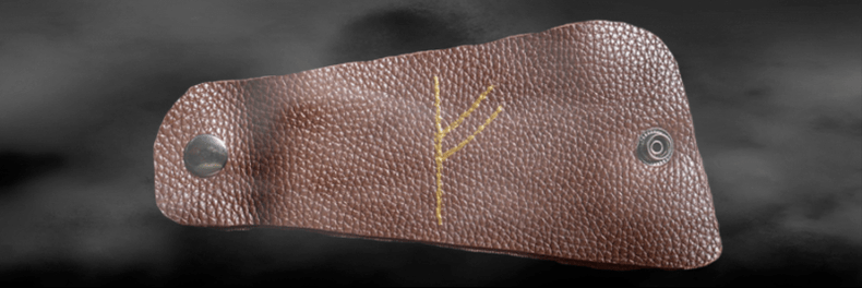 Fehu rune on the skin as a lucky amulet