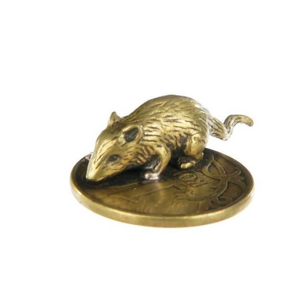 Amulet of a purse mouse with a coin as a good luck charm in financial matters